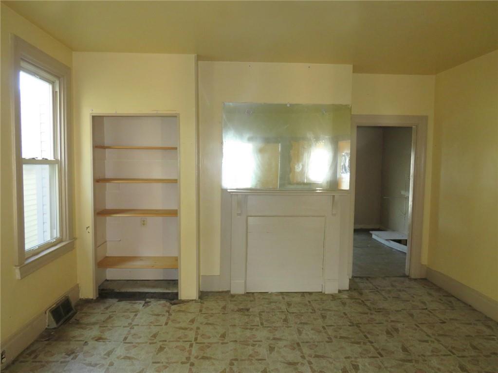 20 Rosamond Street McKees Rocks, PA 15136 - Photo 8 of 17 a view of a hallway with wooden shelves
