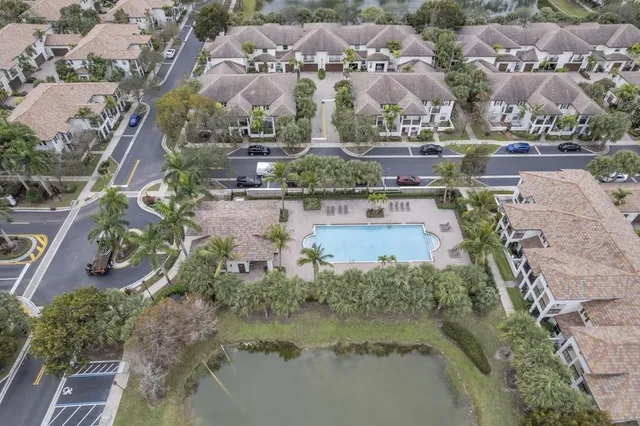 an aerial view of a residential houses with outdoor space