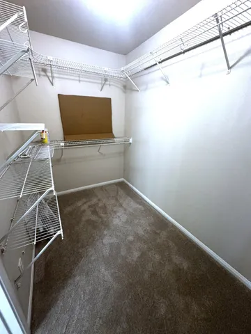 a room with a walk in closet and a window