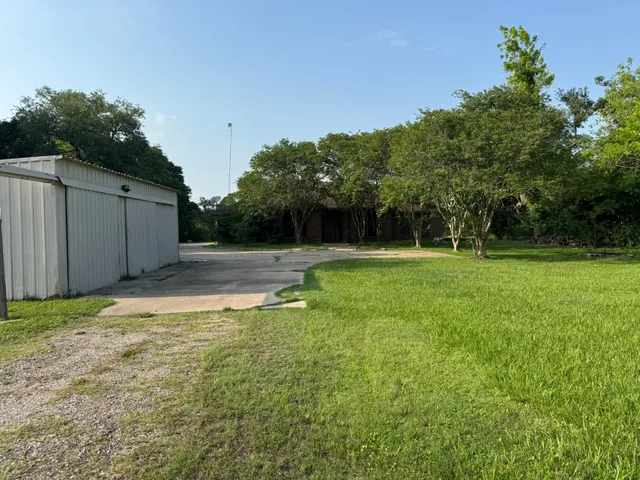 a backyard of a house with lots of green space