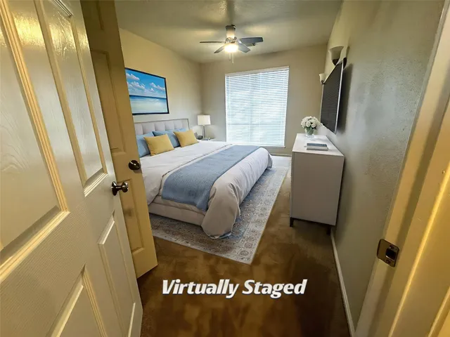 a bedroom with a bed and a mirror