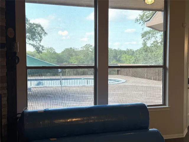 a view of a room with a large window