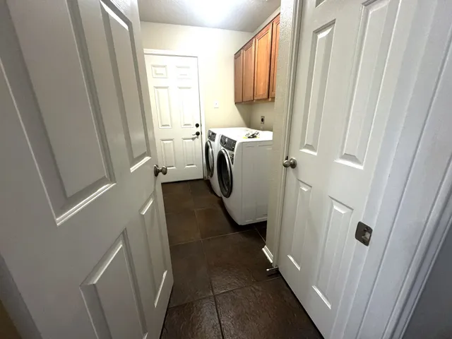 a utility room with a window dryer and washer