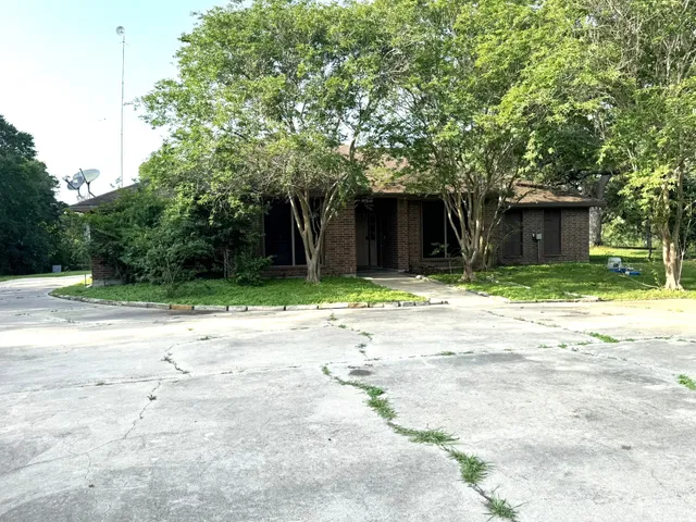 a house with trees in front of it