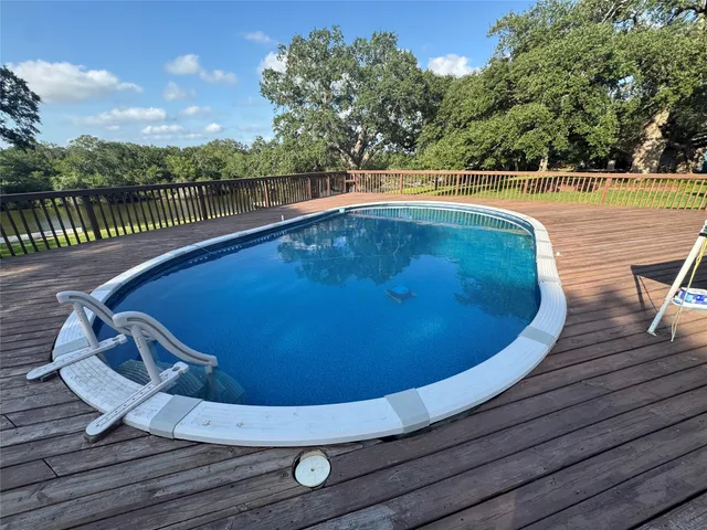 a view of a swimming pool with a patio