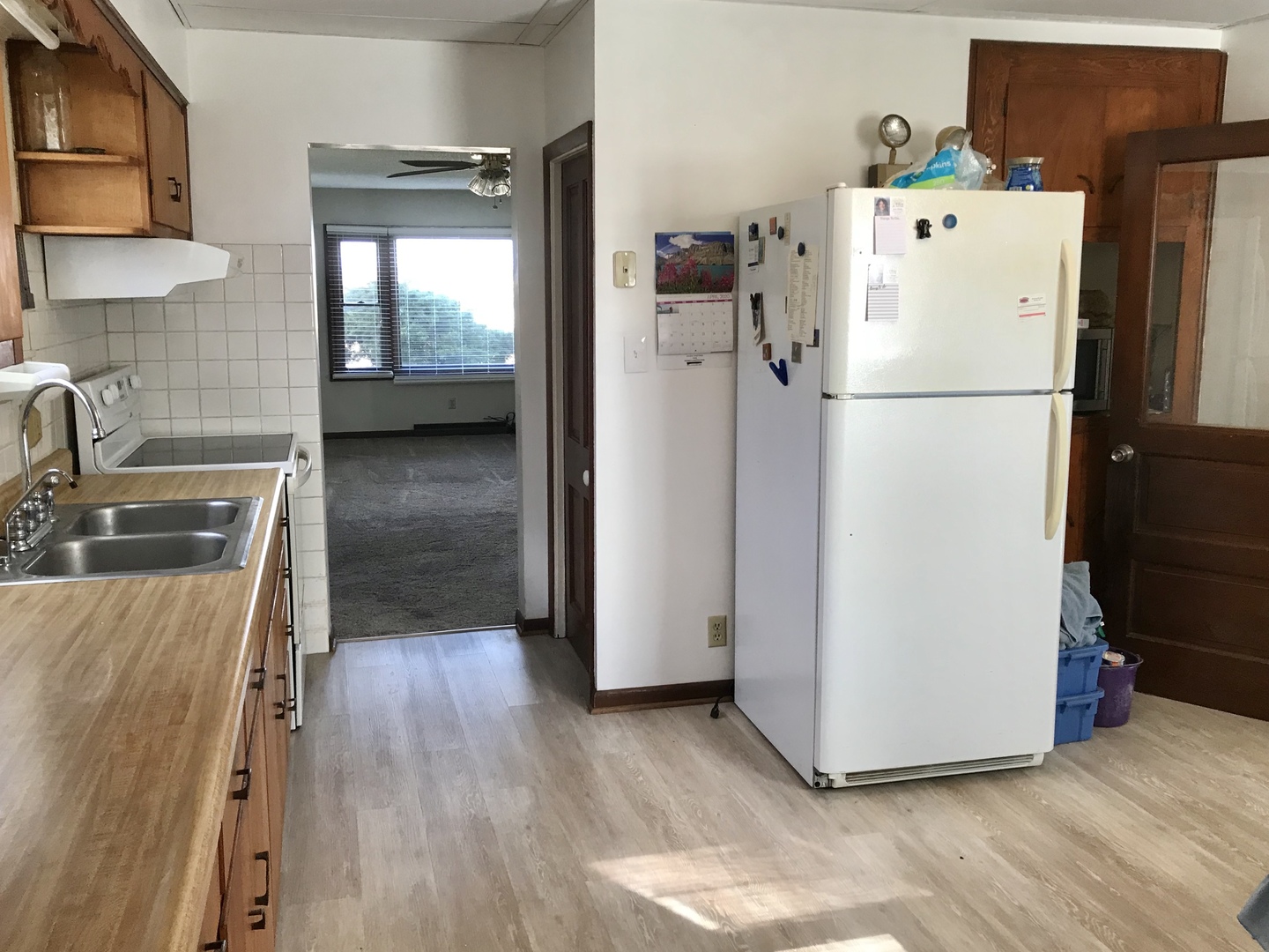 29939 Lukens Road Sycamore, IL 60178 - Photo 7 of 18 a white refrigerator freezer sitting inside of a kitchen