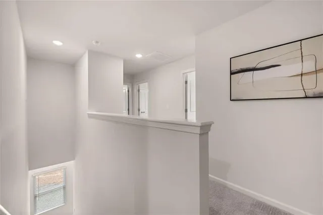 a bed room with couch and a window