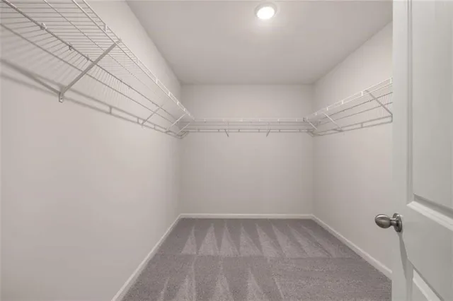 a living room with furniture kitchen and a dining table