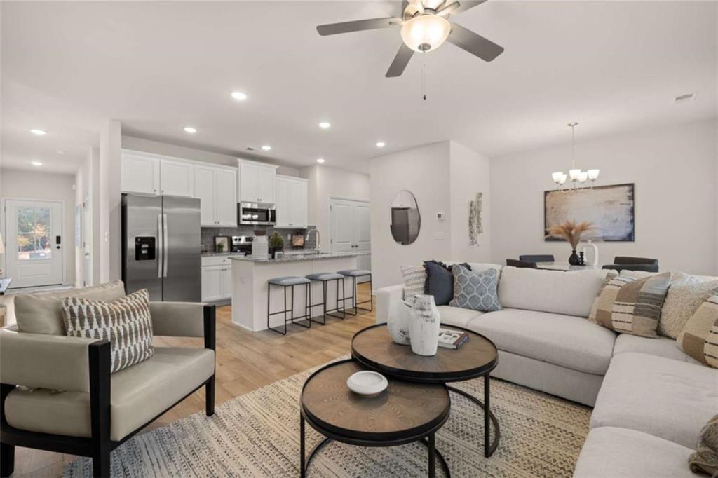 1038 Merritt Drive, Unit 20 Villa Rica, GA 30180 - Photo 27 of 43 a living room with furniture kitchen and a dining table