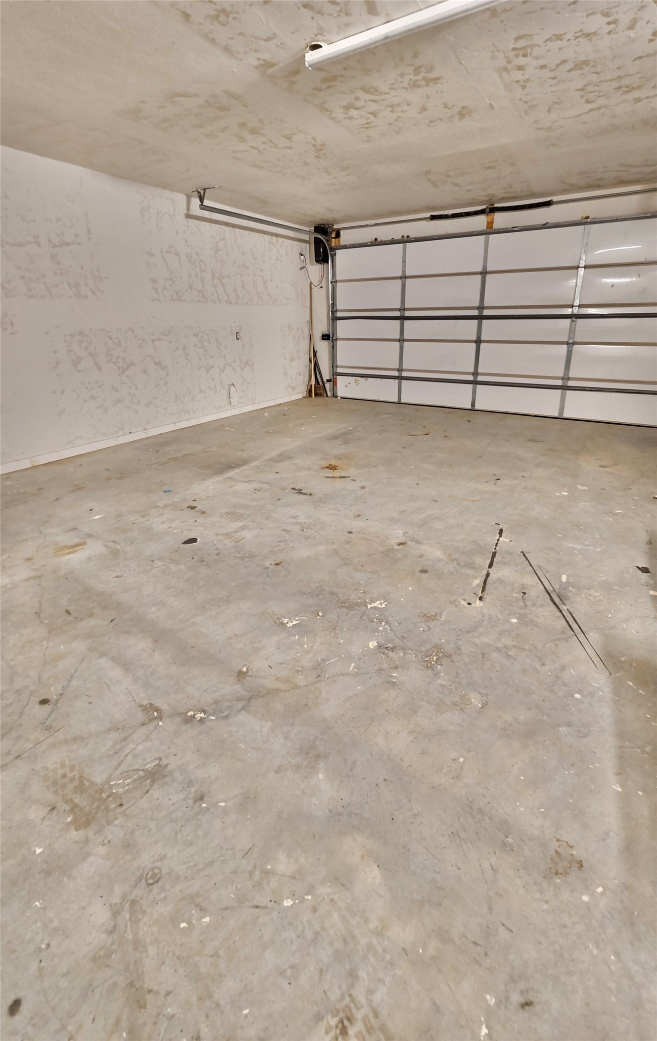 114495 South 4296th Road Porum, OK 74455 - Photo 50 of 59 Garage space with an overhead door, concrete flooring