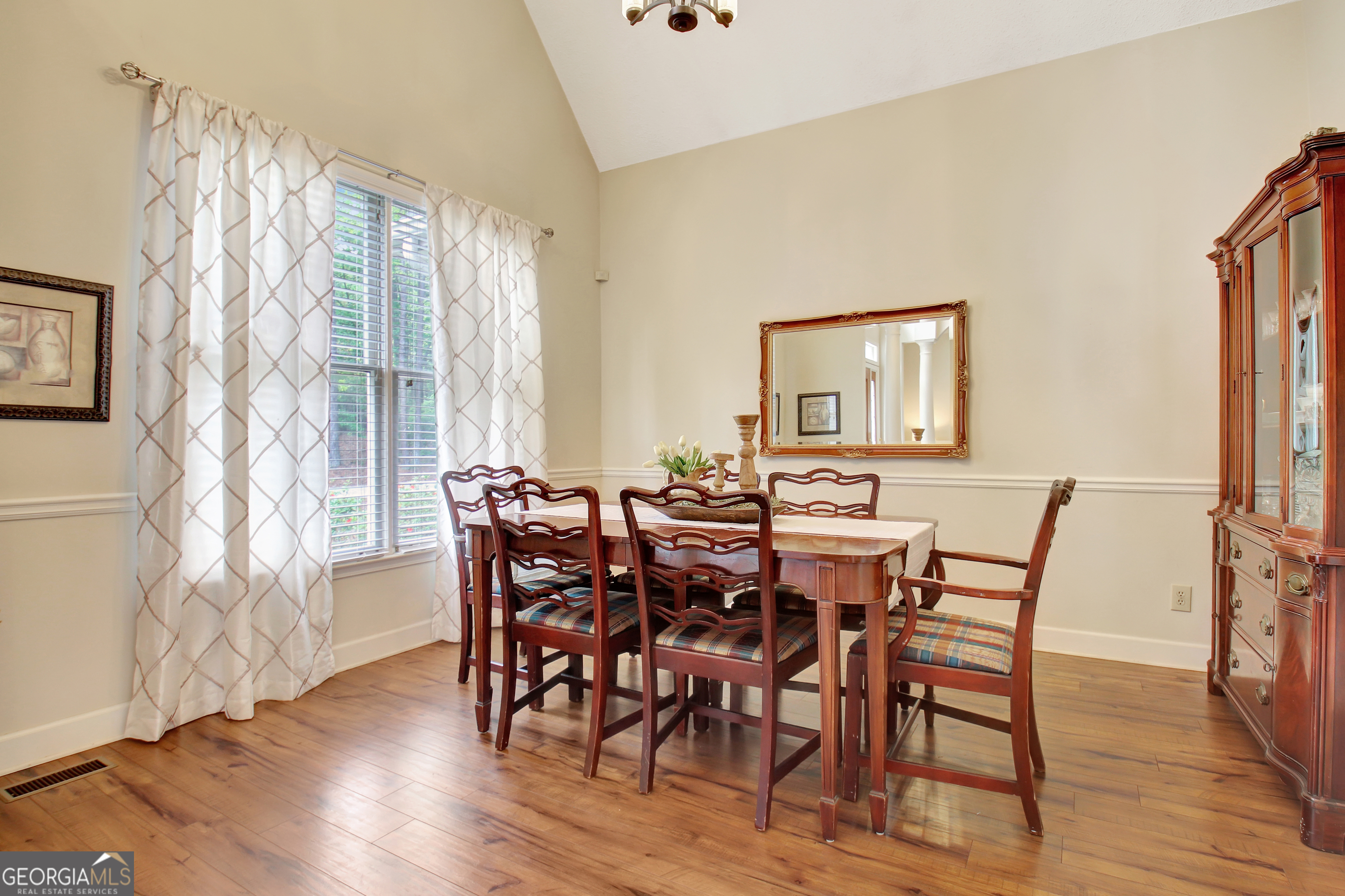 110 Sunset Court Senoia, GA 30276 - Photo 17 of 118 a view of a dining room with furniture and wooden floor