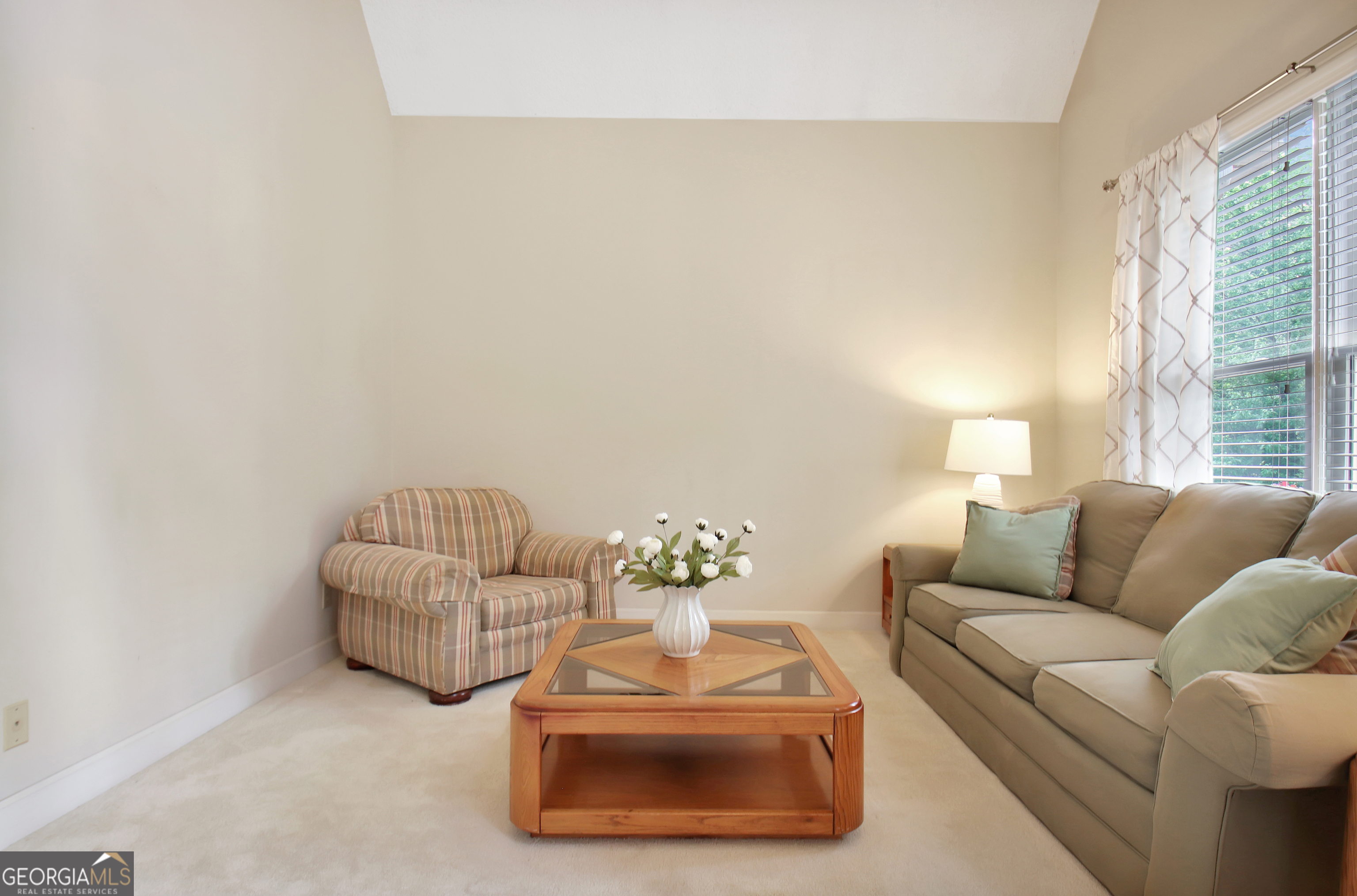 110 Sunset Court Senoia, GA 30276 - Photo 22 of 118 a living room with furniture and a large window