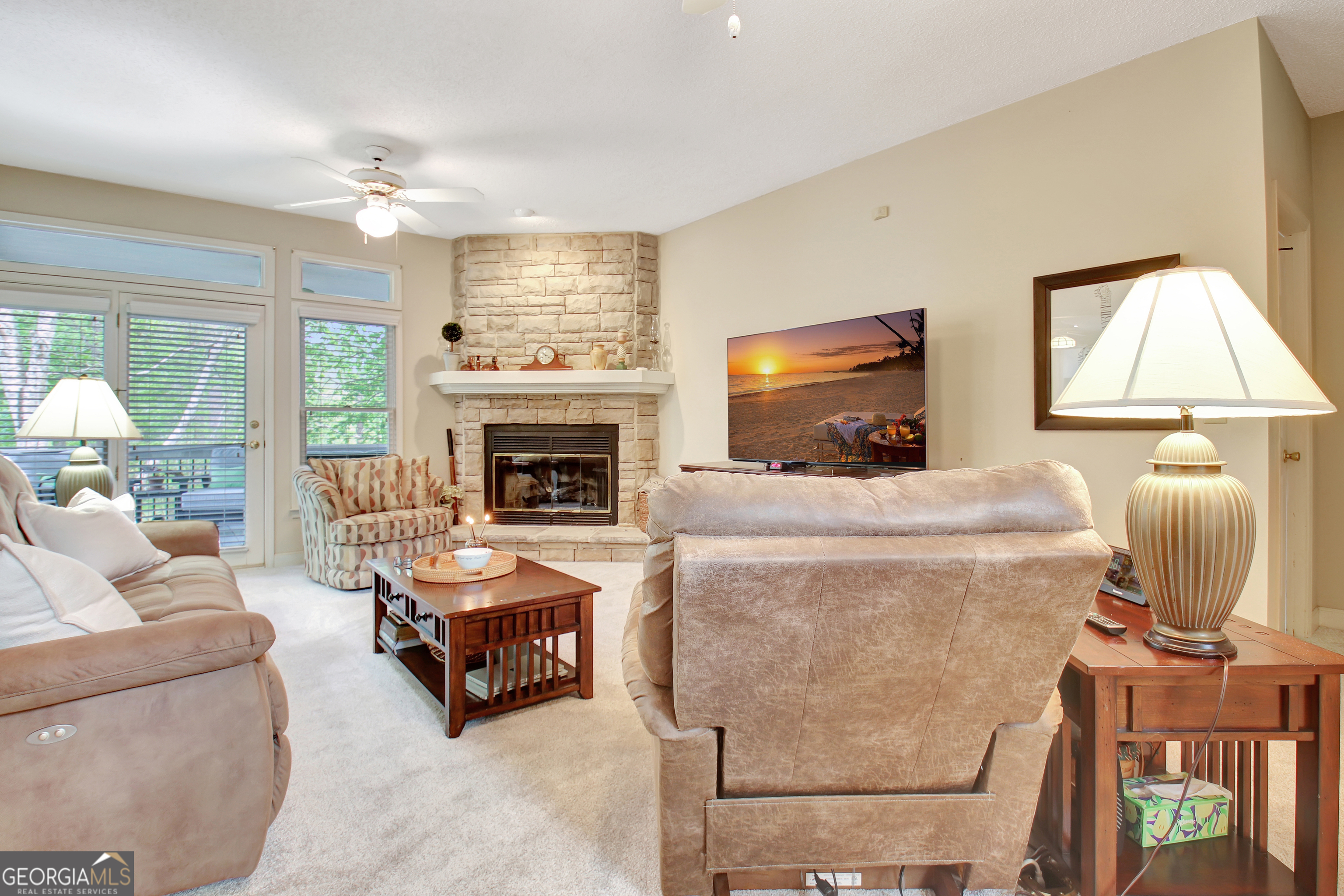 110 Sunset Court Senoia, GA 30276 - Photo 27 of 118 a living room with furniture a fireplace and a flat screen tv