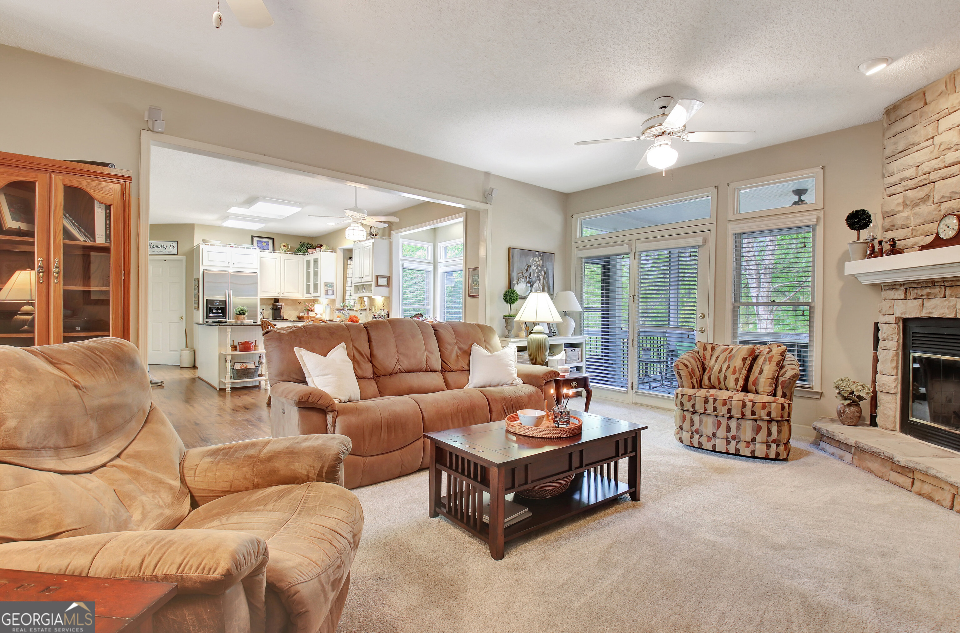 110 Sunset Court Senoia, GA 30276 - Photo 31 of 118 a living room with furniture and a fireplace