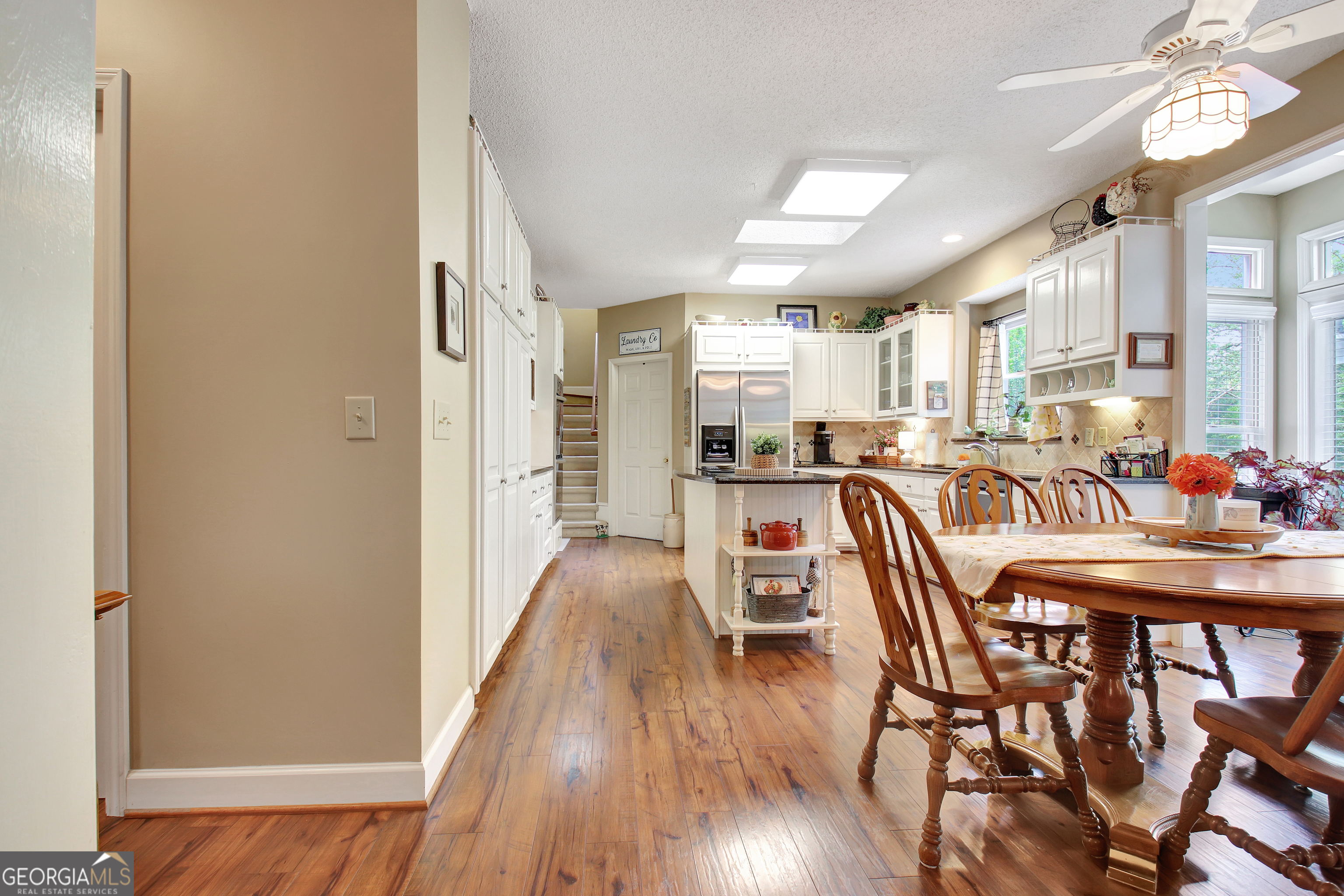 110 Sunset Court Senoia, GA 30276 - Photo 32 of 118 a dining room with furniture and wooden floor