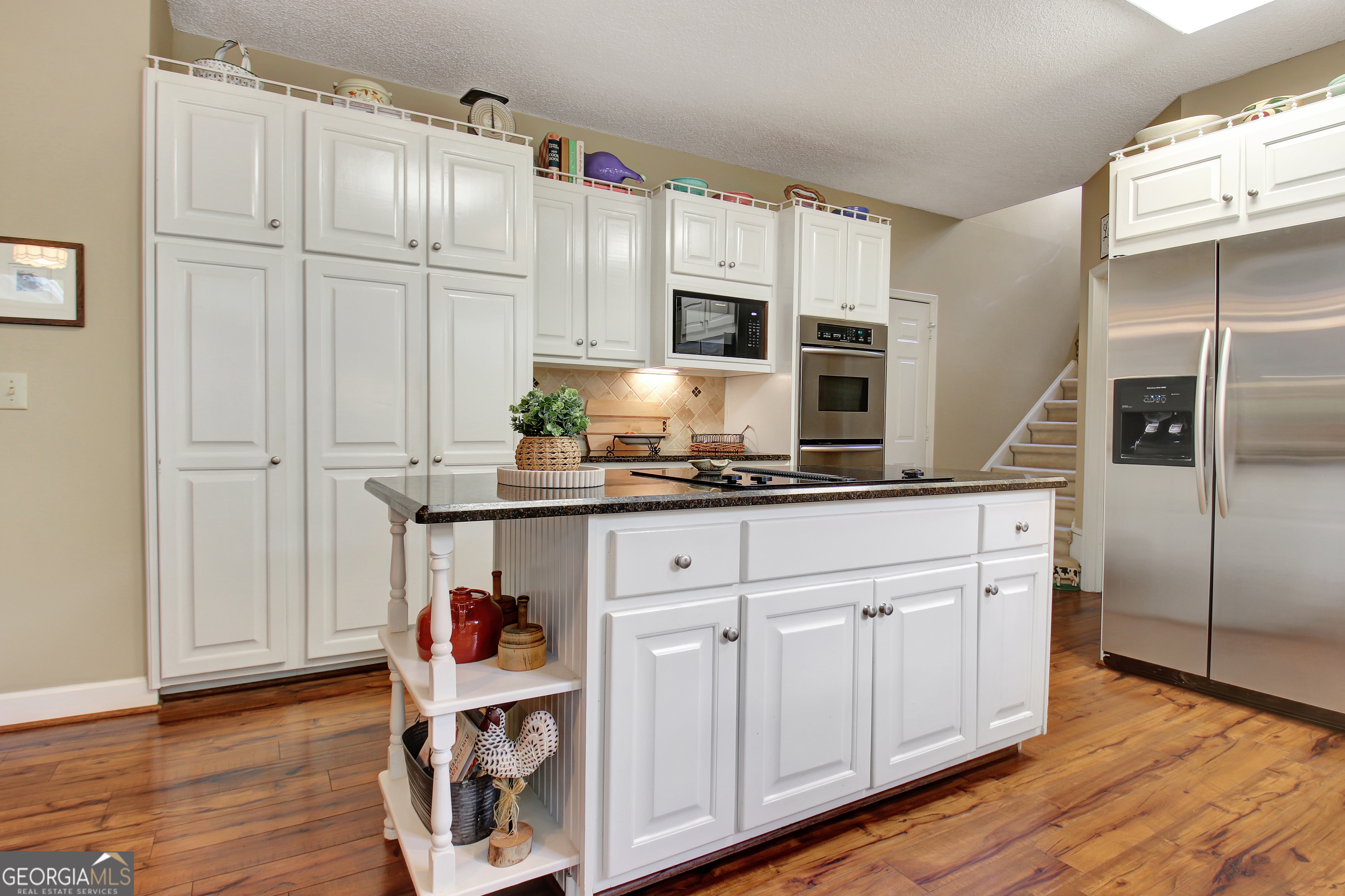 110 Sunset Court Senoia, GA 30276 - Photo 38 of 118 a kitchen with stainless steel appliances granite countertop a refrigerator and a stove top oven