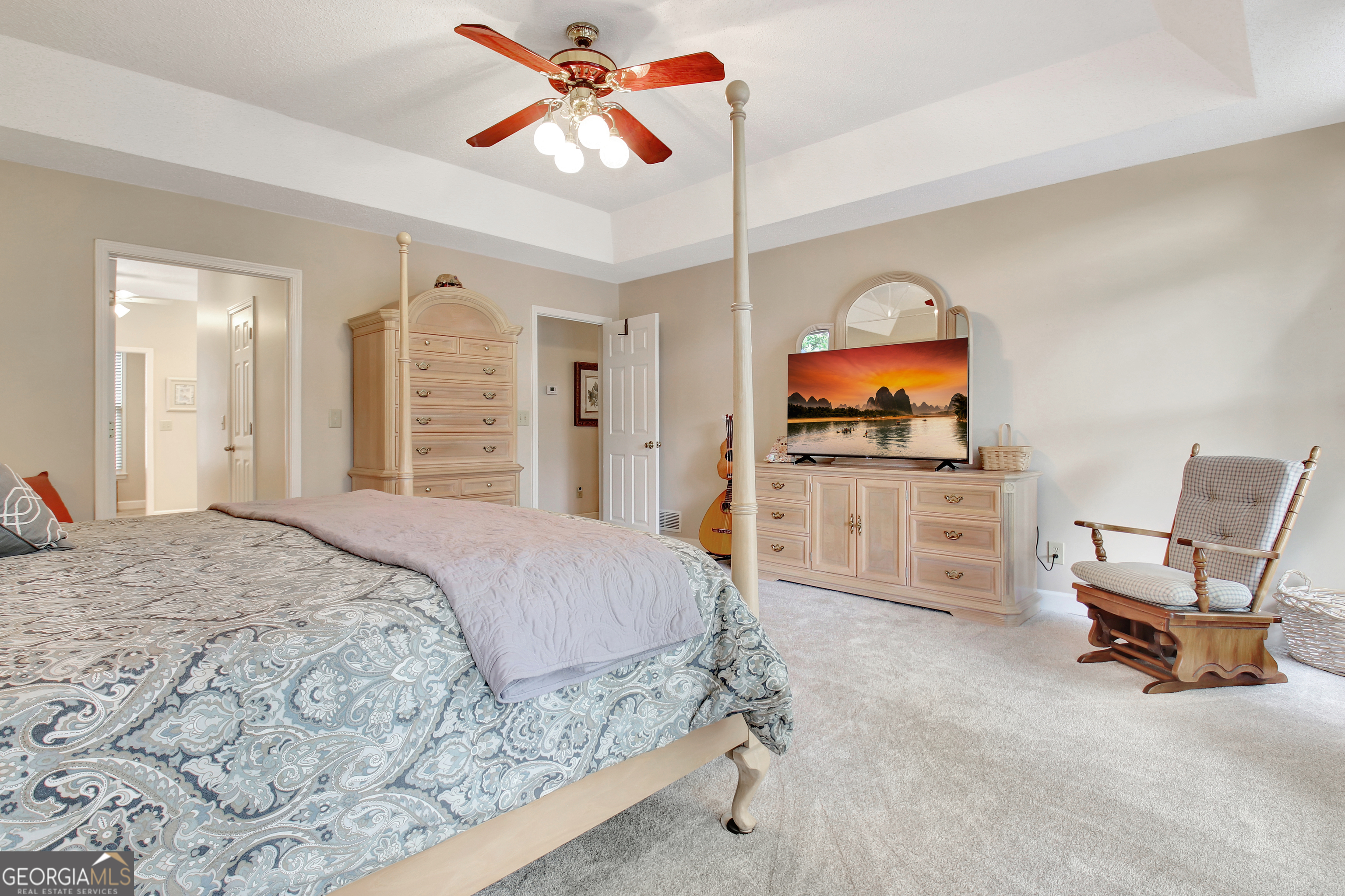 110 Sunset Court Senoia, GA 30276 - Photo 60 of 118 a bedroom with a bed and a flat screen tv