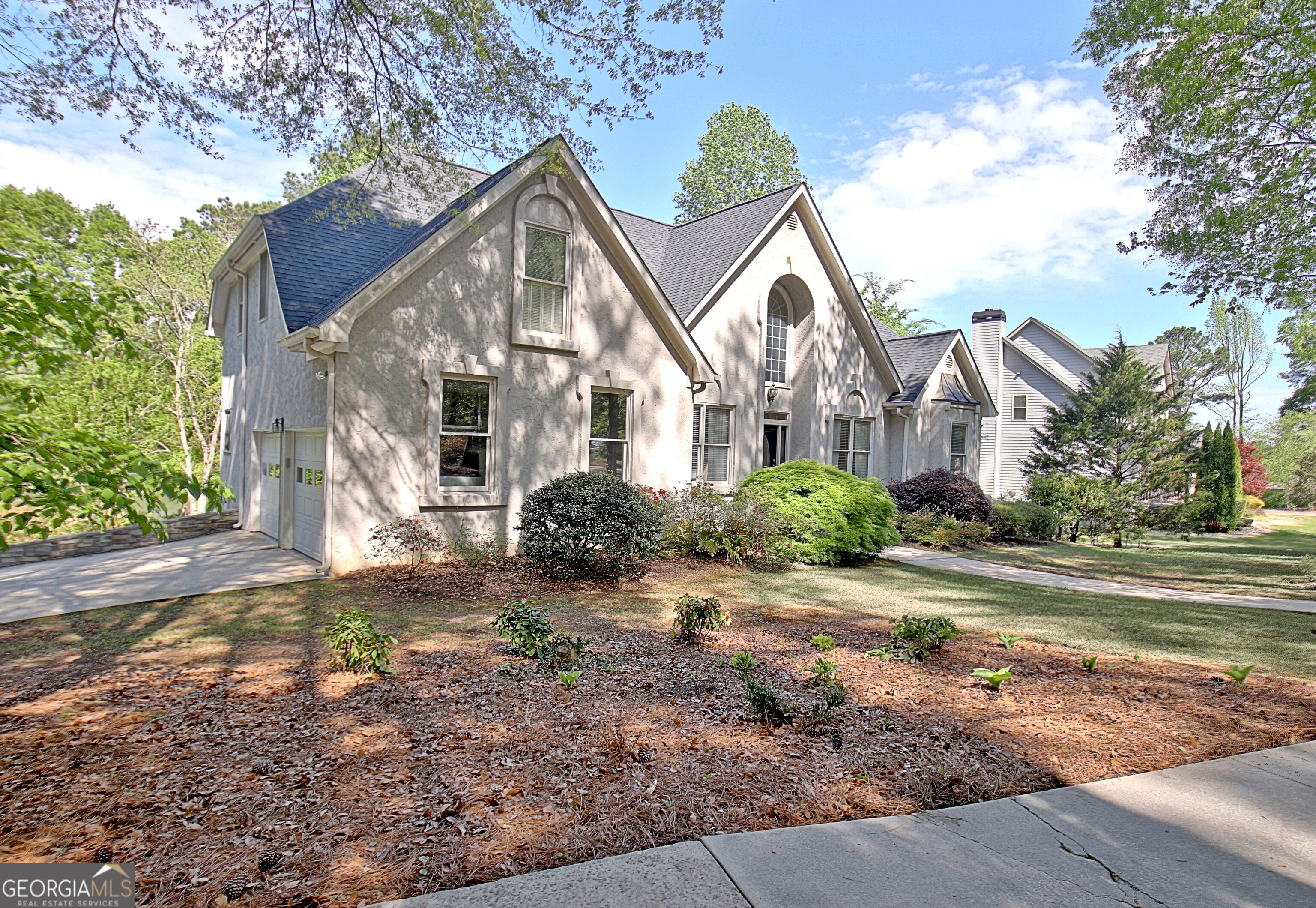 110 Sunset Court Senoia, GA 30276 - Photo 7 of 118 a view of a large house with a yard and large tree