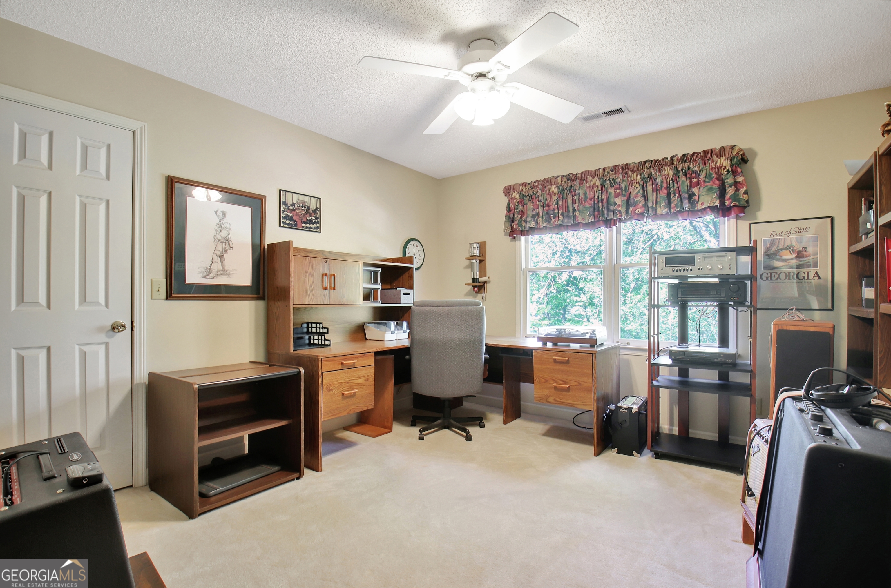 110 Sunset Court Senoia, GA 30276 - Photo 74 of 118 a view of a workspace with furniture and a window