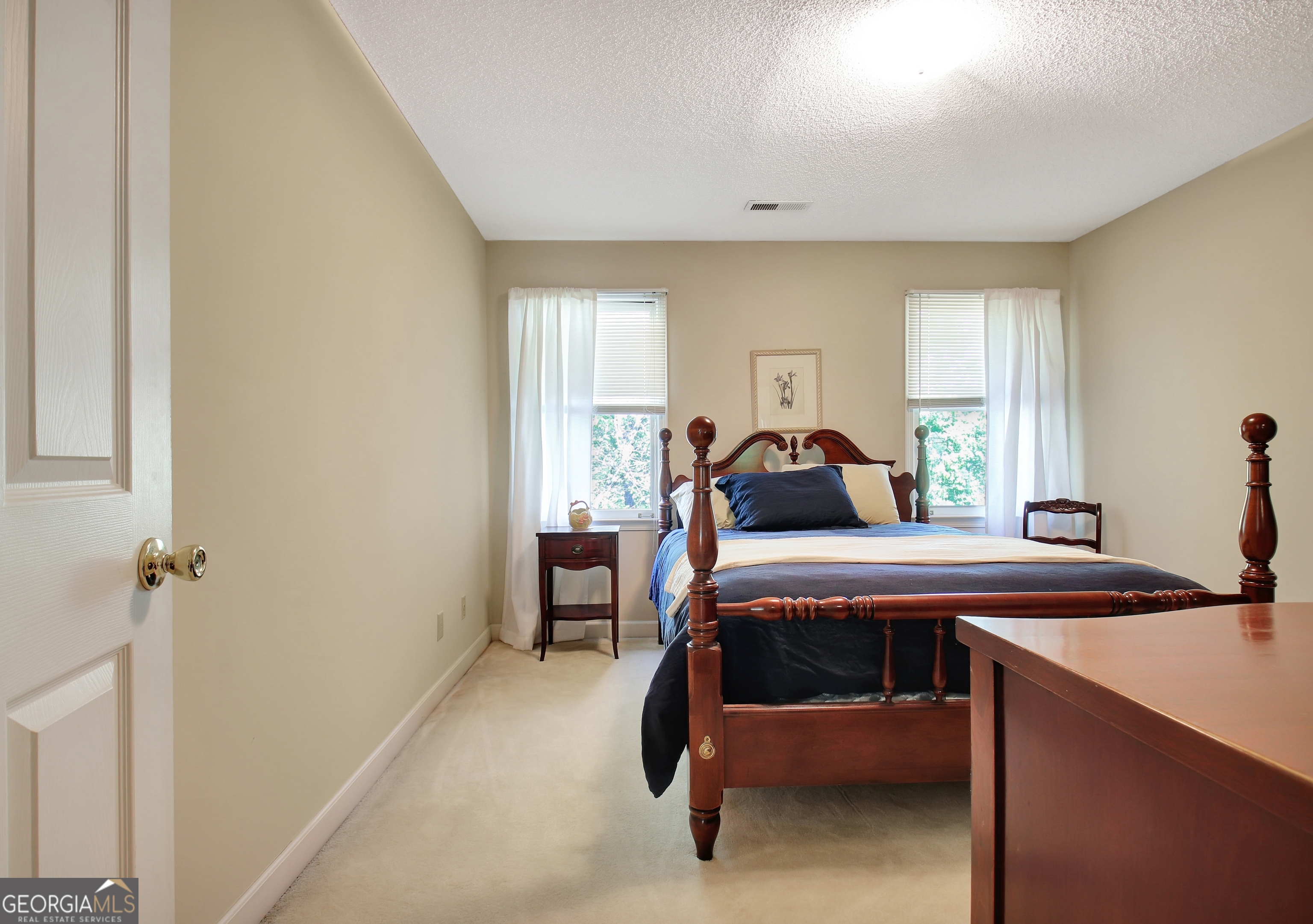 110 Sunset Court Senoia, GA 30276 - Photo 80 of 118 a bedroom with a bed and a table