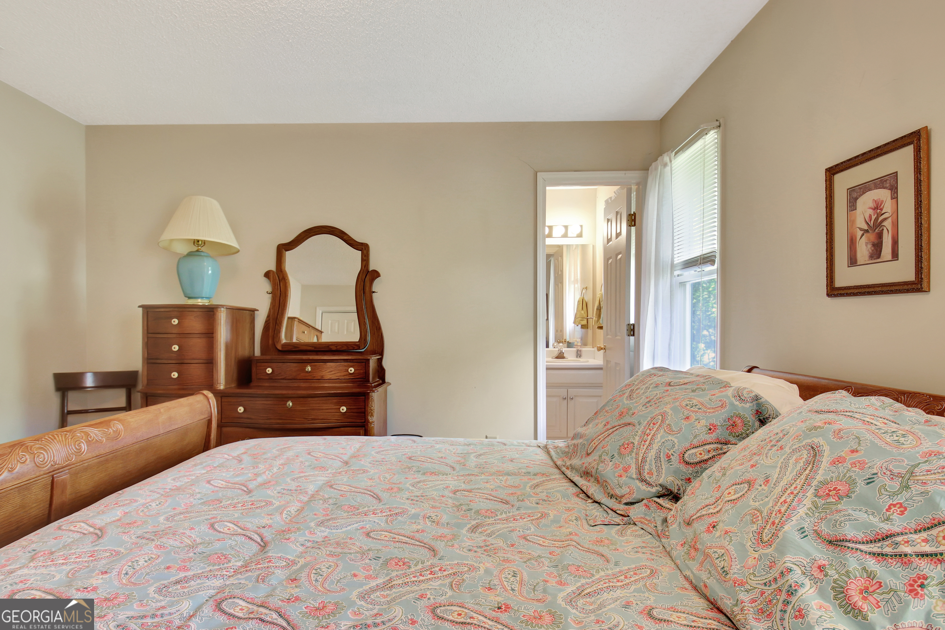 110 Sunset Court Senoia, GA 30276 - Photo 84 of 118 a bedroom with a bed and a dresser