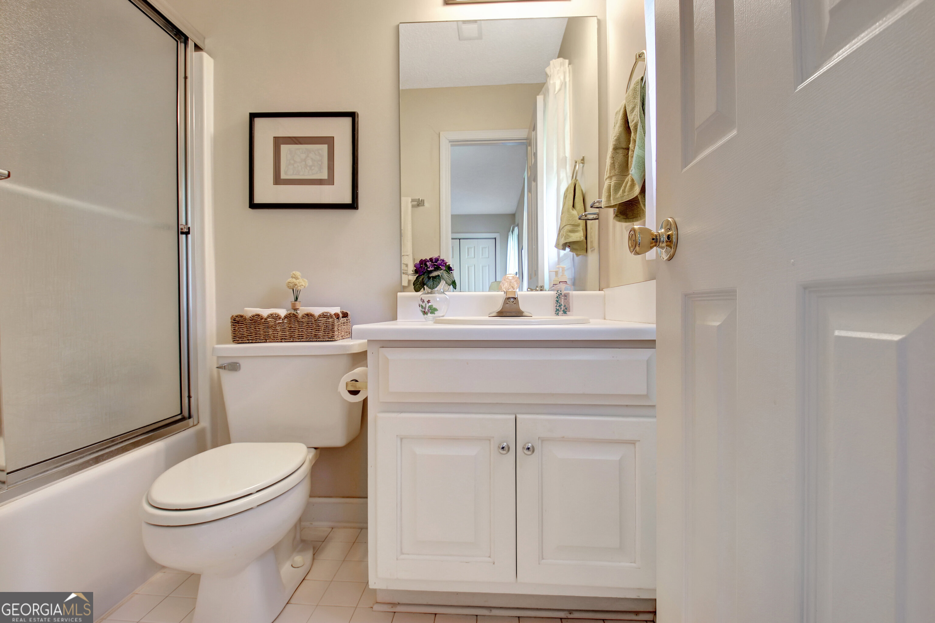 110 Sunset Court Senoia, GA 30276 - Photo 85 of 118 a bathroom with a toilet a sink and a mirror