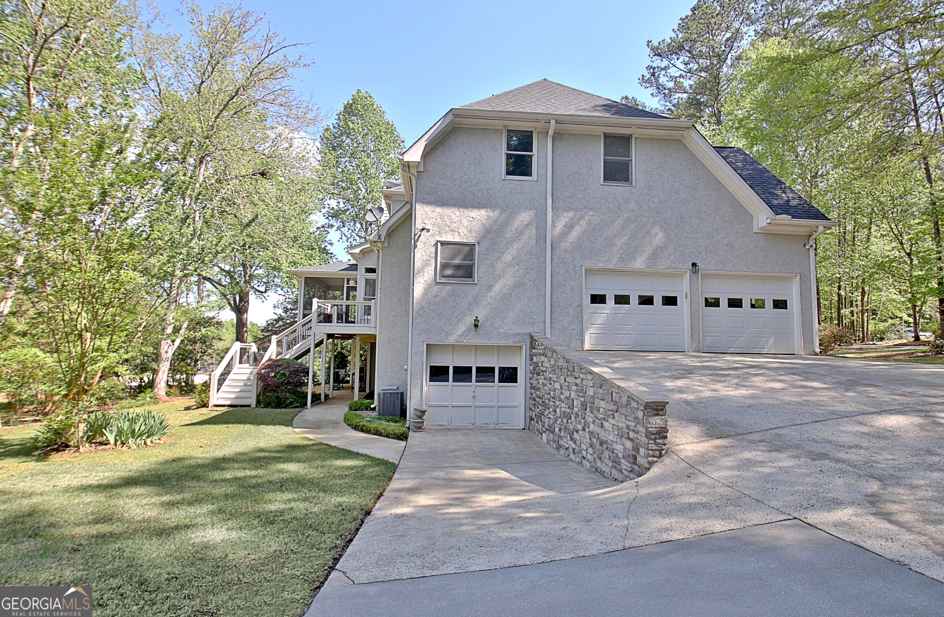 110 Sunset Court Senoia, GA 30276 - Photo 10 of 118 a view of a white house with a yard and large tree