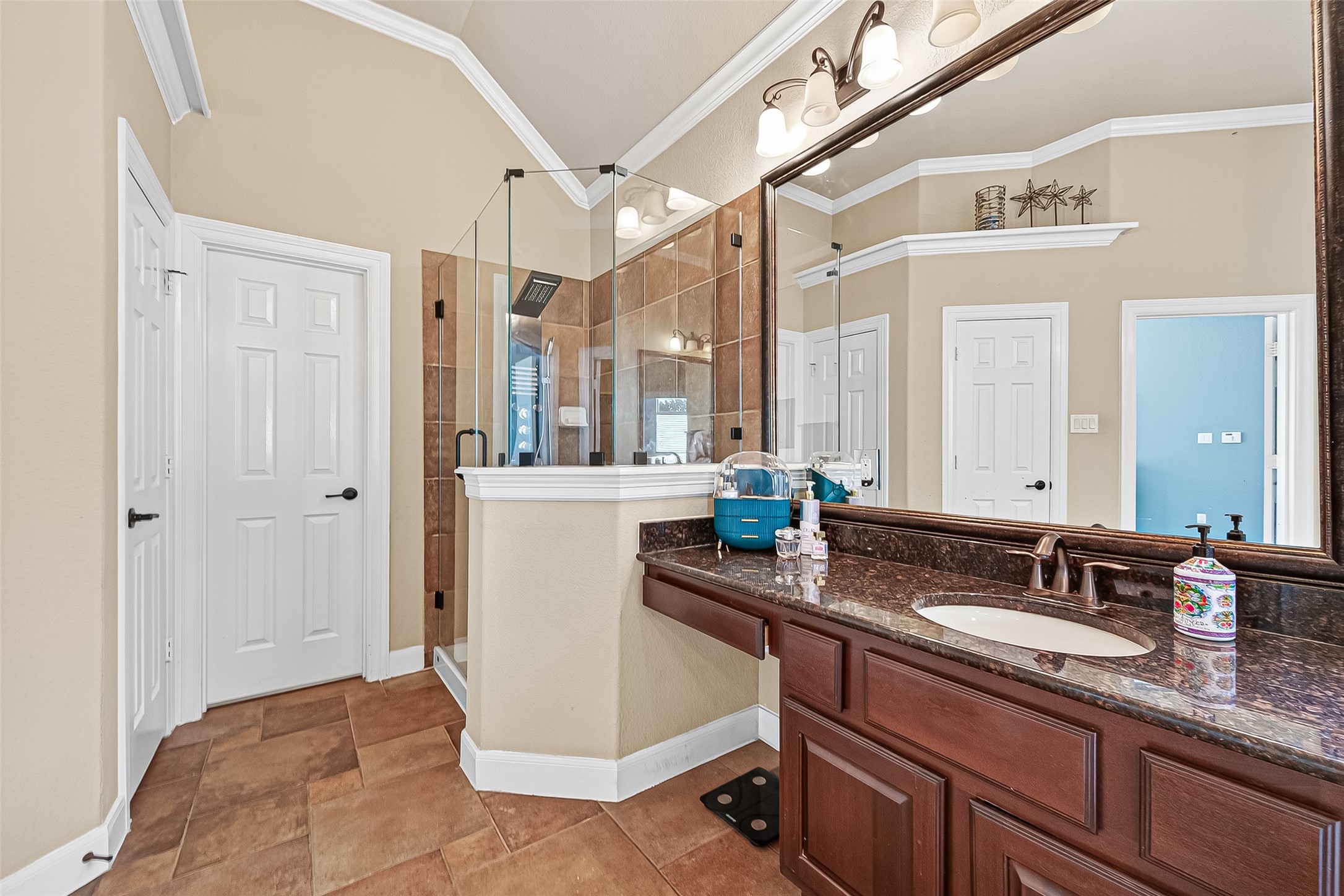 1206 Coleridge Street Sugar Land, TX 77479 - Photo 16 of 46 a spacious bathroom with a granite countertop sink a mirror and a