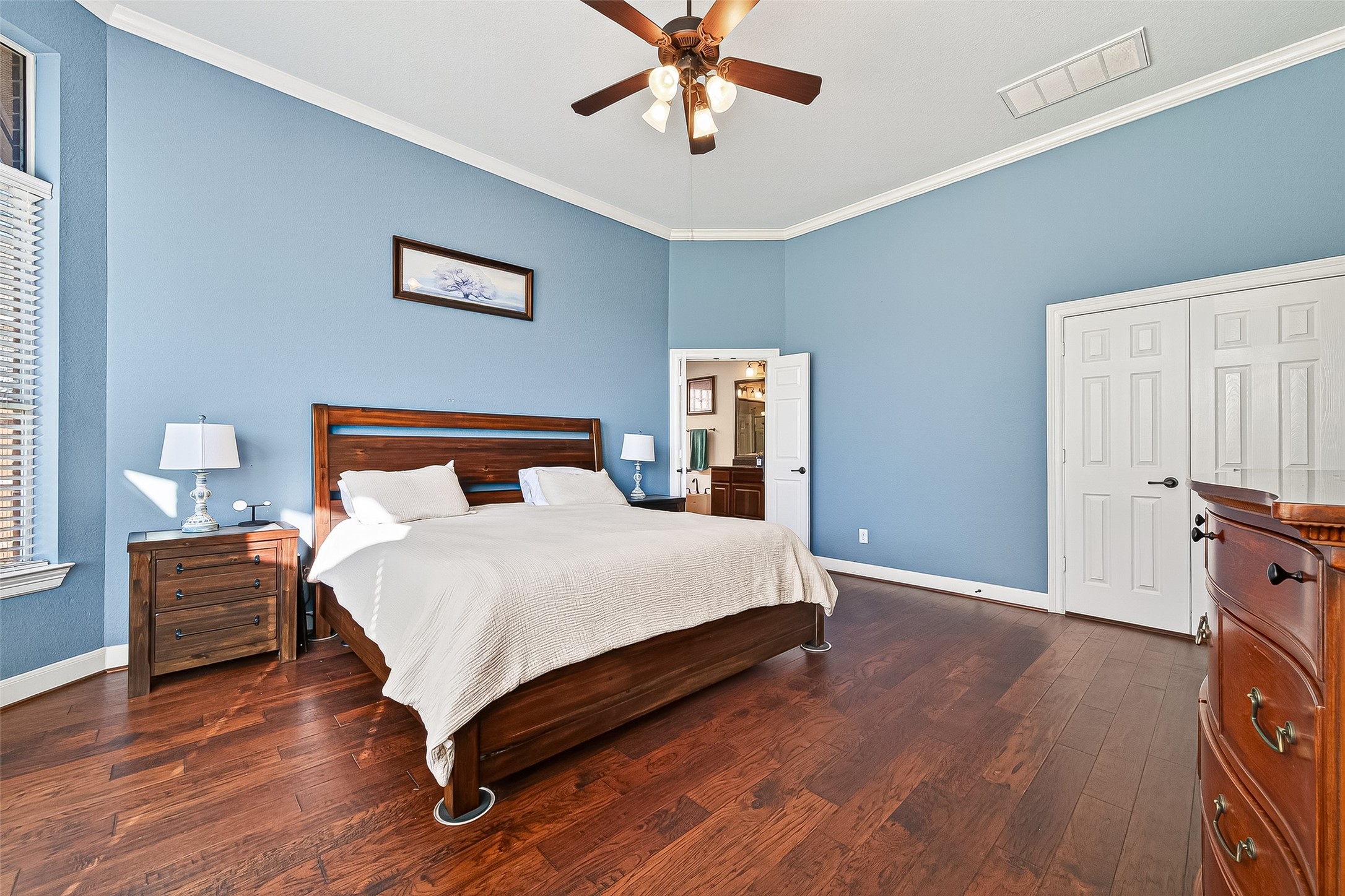 1206 Coleridge Street Sugar Land, TX 77479 - Photo 20 of 46 a bedroom with a bed and wooden floor