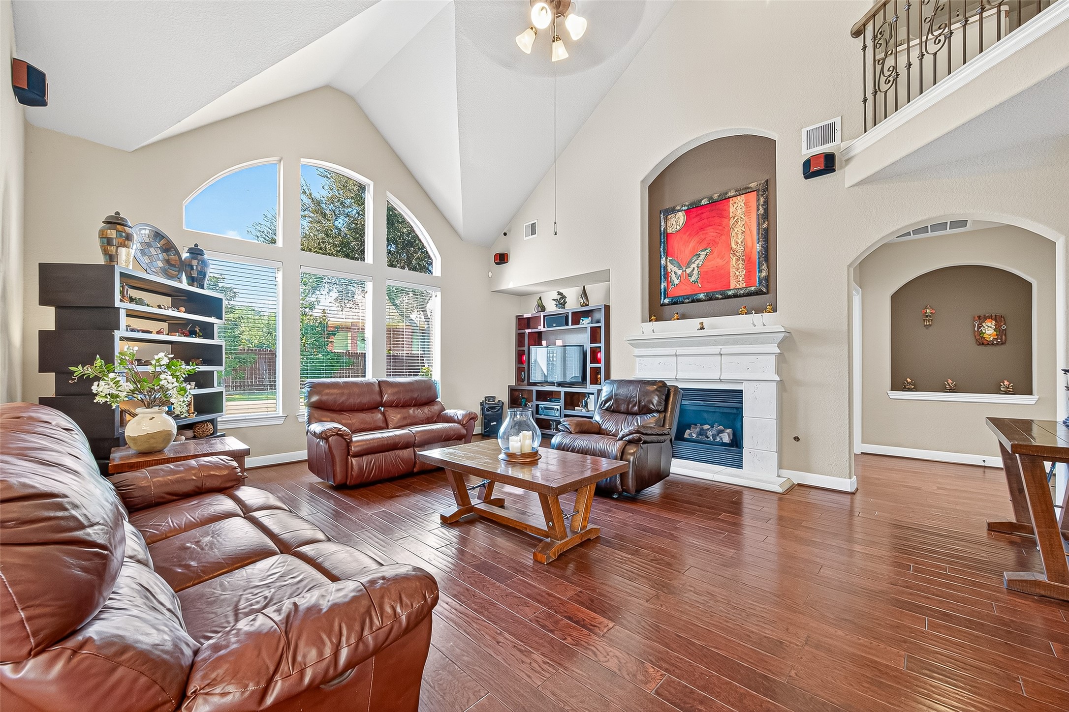 1206 Coleridge Street Sugar Land, TX 77479 - Photo 31 of 46 a living room with furniture a fireplace and a floor to ceiling window
