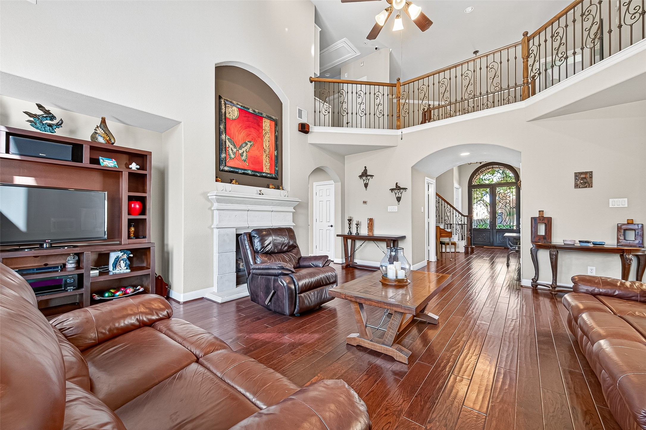 1206 Coleridge Street Sugar Land, TX 77479 - Photo 34 of 46 a living room with fireplace furniture and a flat screen tv