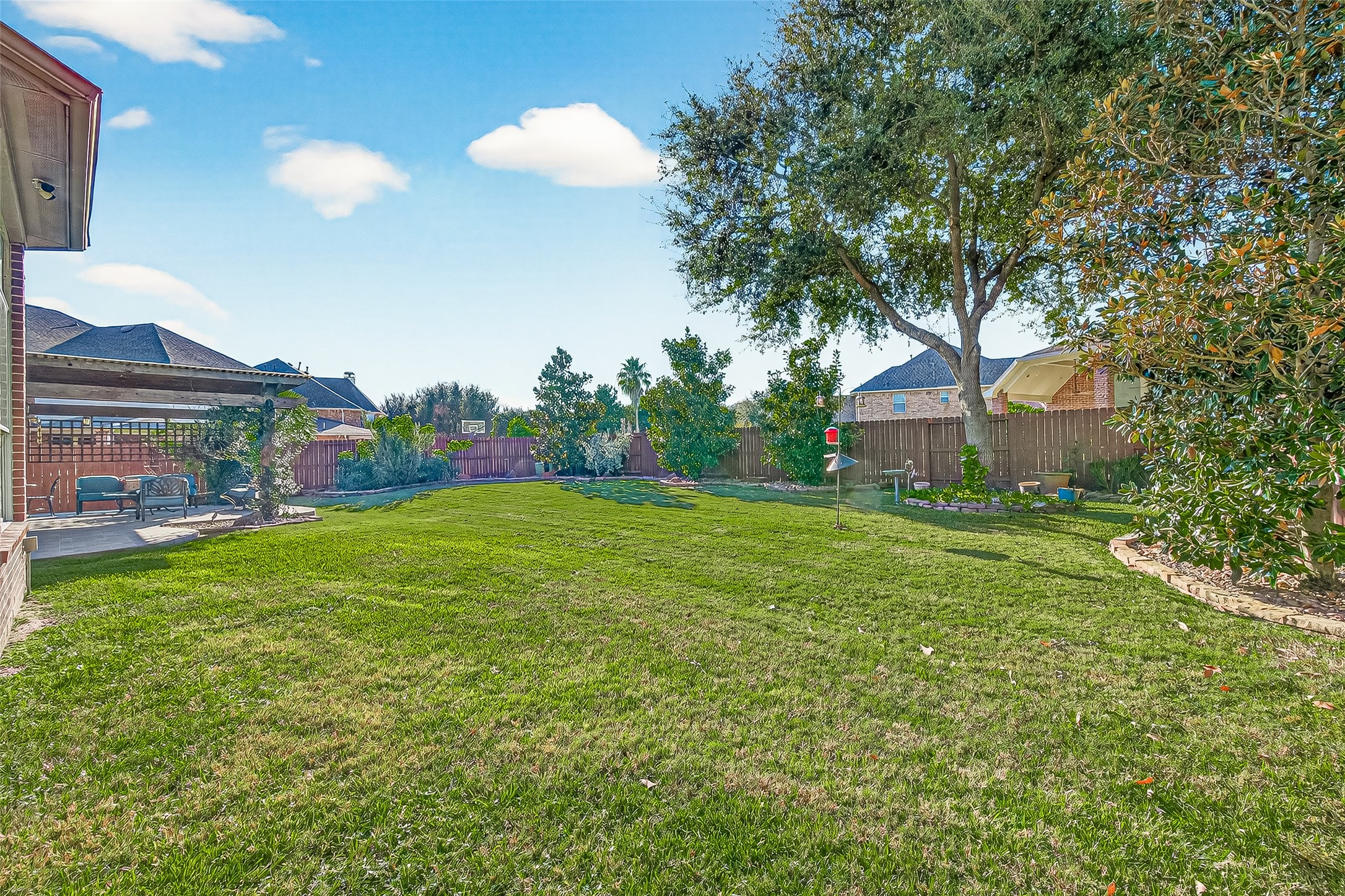 1206 Coleridge Street Sugar Land, TX 77479 - Photo 35 of 46 a front view of a house with garden