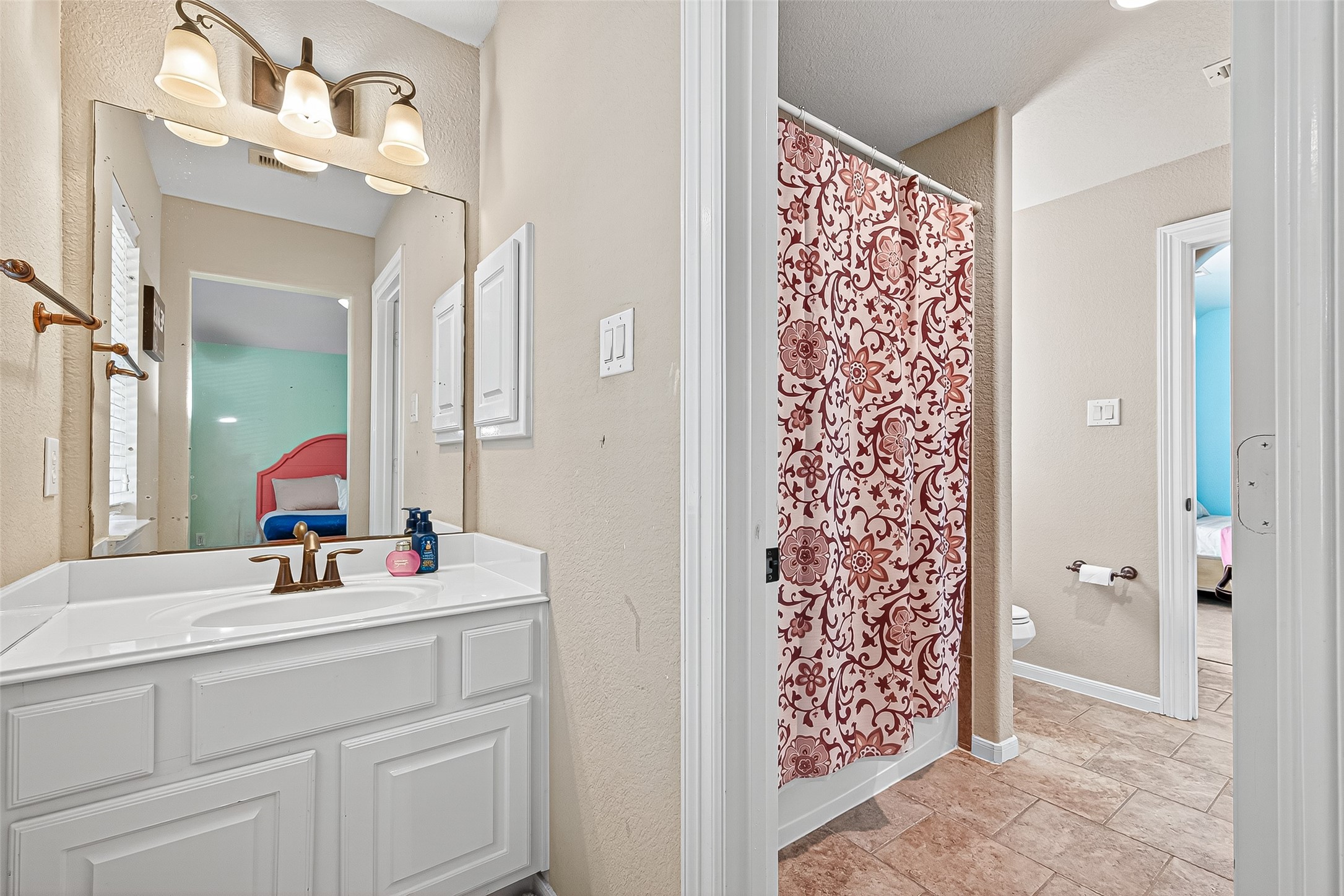 1206 Coleridge Street Sugar Land, TX 77479 - Photo 39 of 46 a bathroom with a sink vanity and a mirror