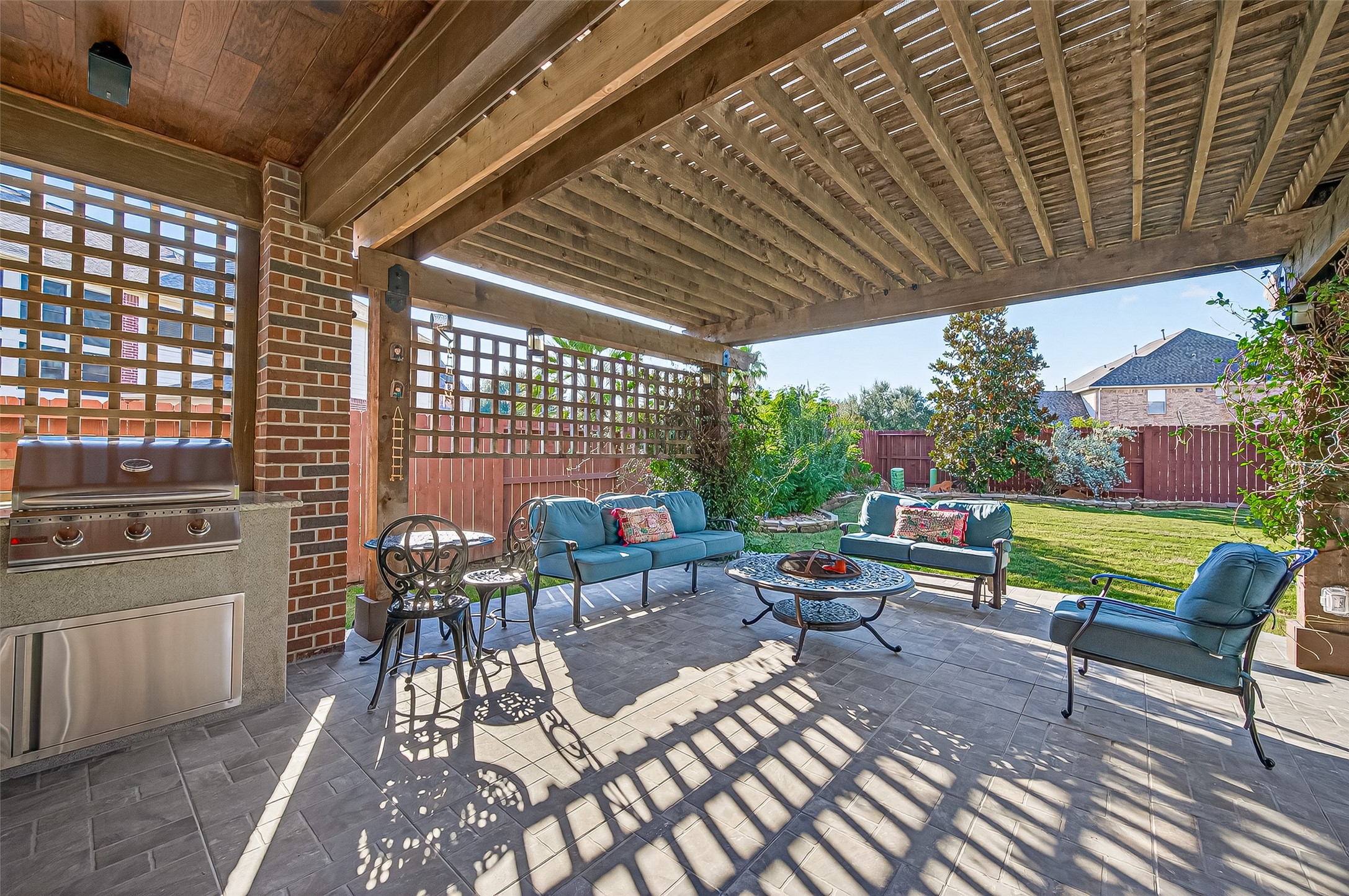 1206 Coleridge Street Sugar Land, TX 77479 - Photo 43 of 46 a view of a patio with couches chairs dining table and chairs with wooden floor