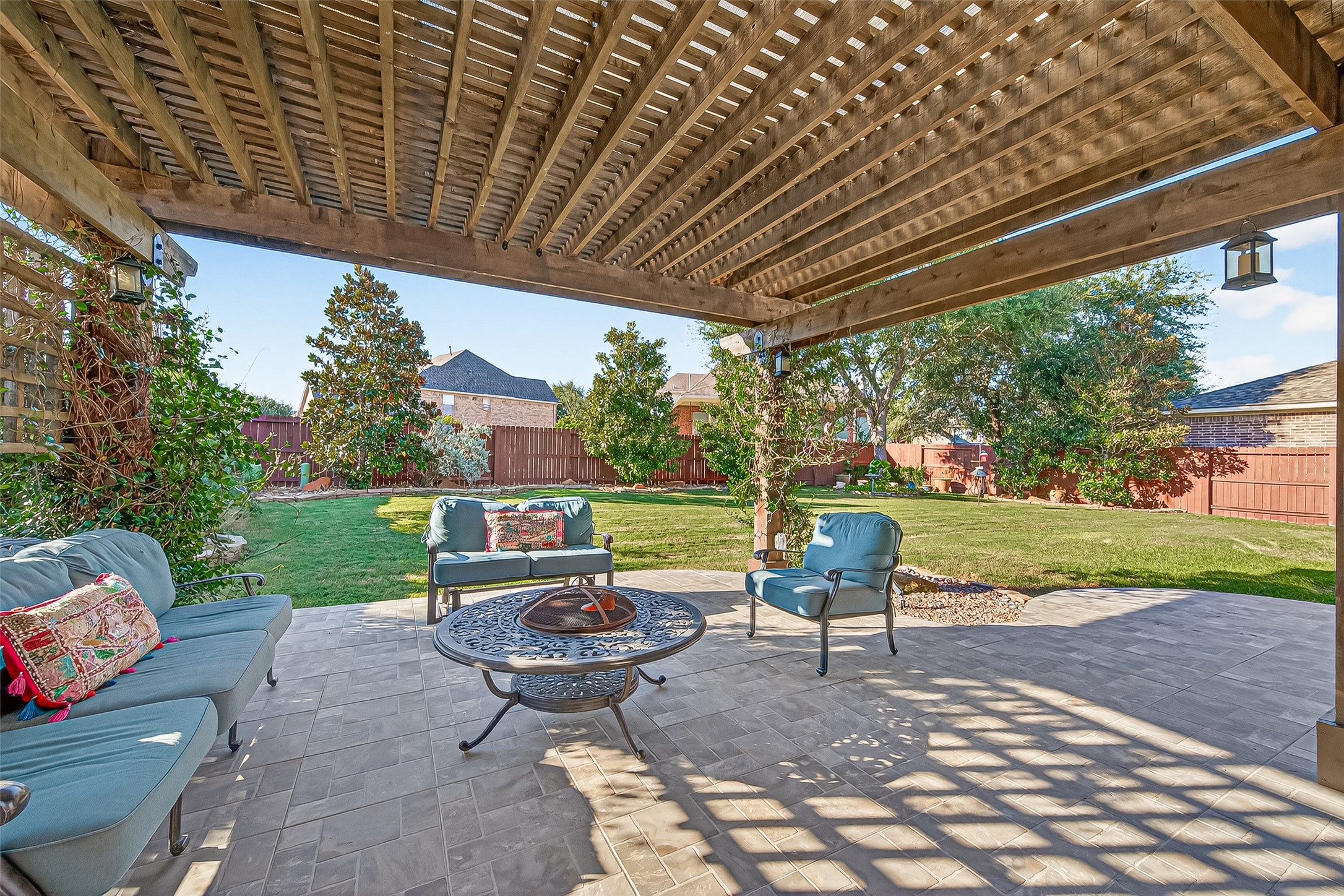 1206 Coleridge Street Sugar Land, TX 77479 - Photo 44 of 46 a view of a patio with table and chairs potted plants and a big yard