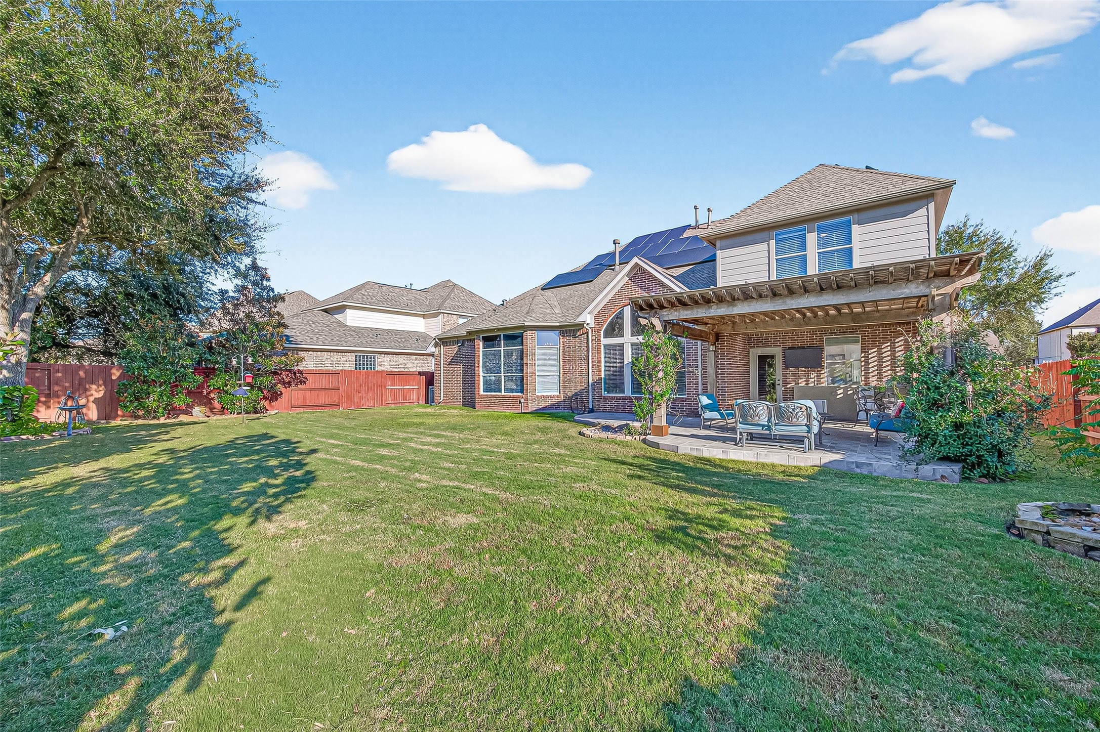 1206 Coleridge Street Sugar Land, TX 77479 - Photo 5 of 46 a view of a house with a big yard plants and large trees