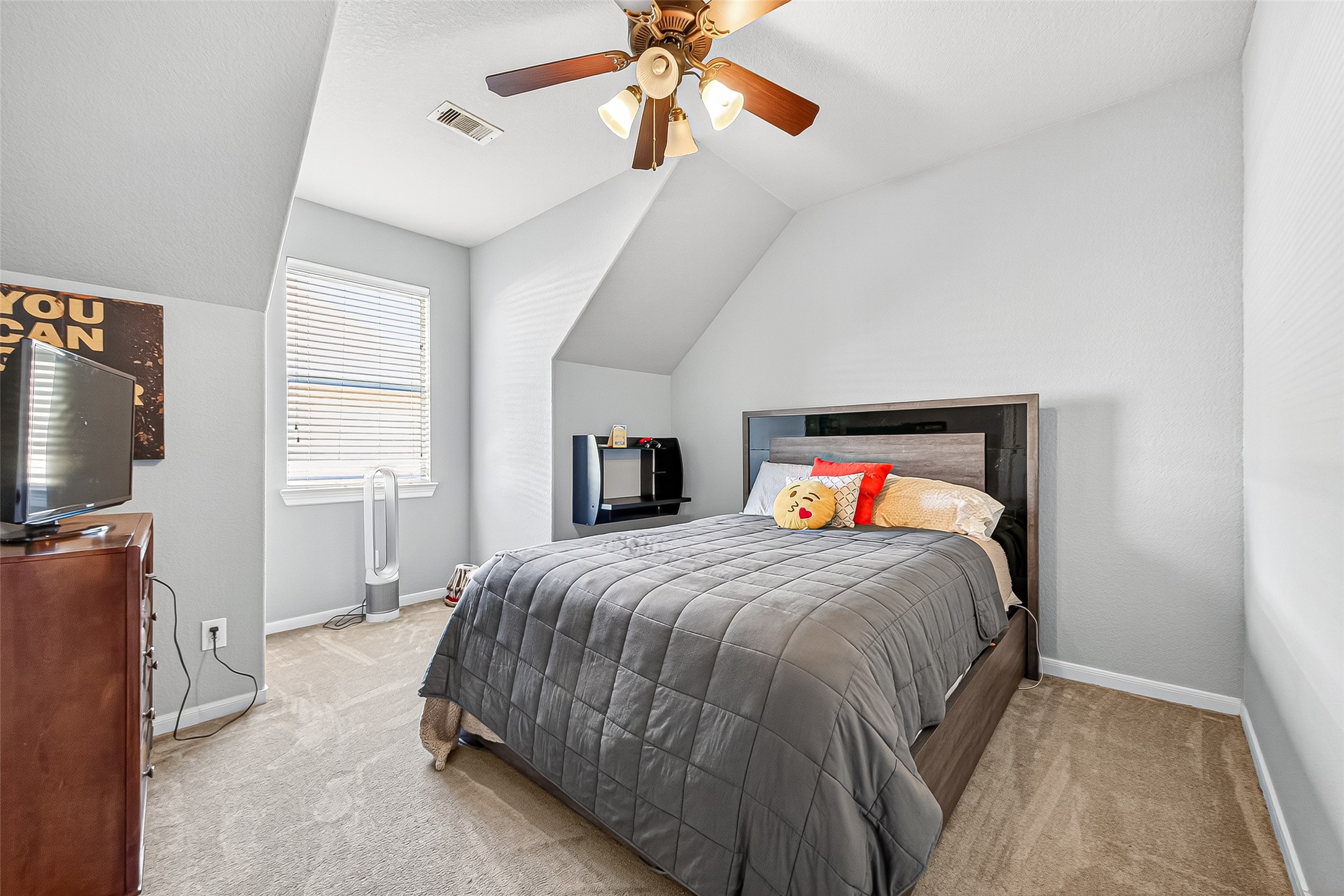 1206 Coleridge Street Sugar Land, TX 77479 - Photo 9 of 46 a bedroom with a bed and a flat tv screen