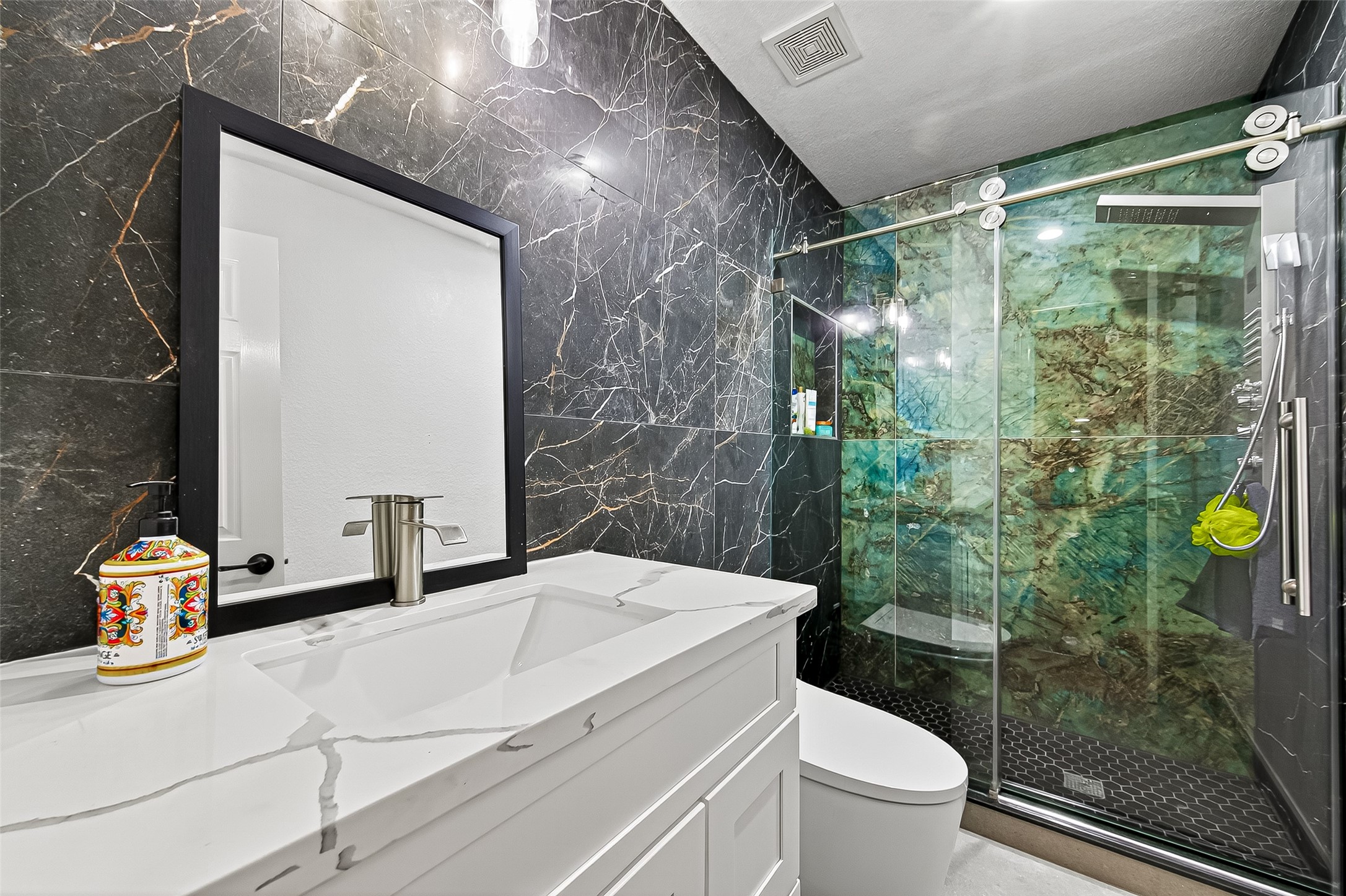 1206 Coleridge Street Sugar Land, TX 77479 - Photo 10 of 46 a bathroom with a sink mirror toilet and shower