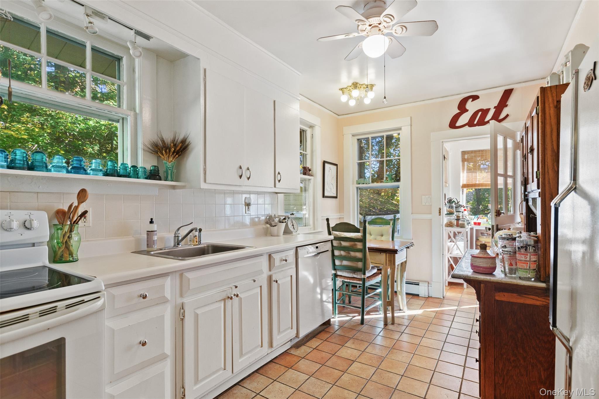 1753 Lawrence Road Mohegan Lake, NY 10547 - Photo 13 of 33 a kitchen with a sink stove and cabinets