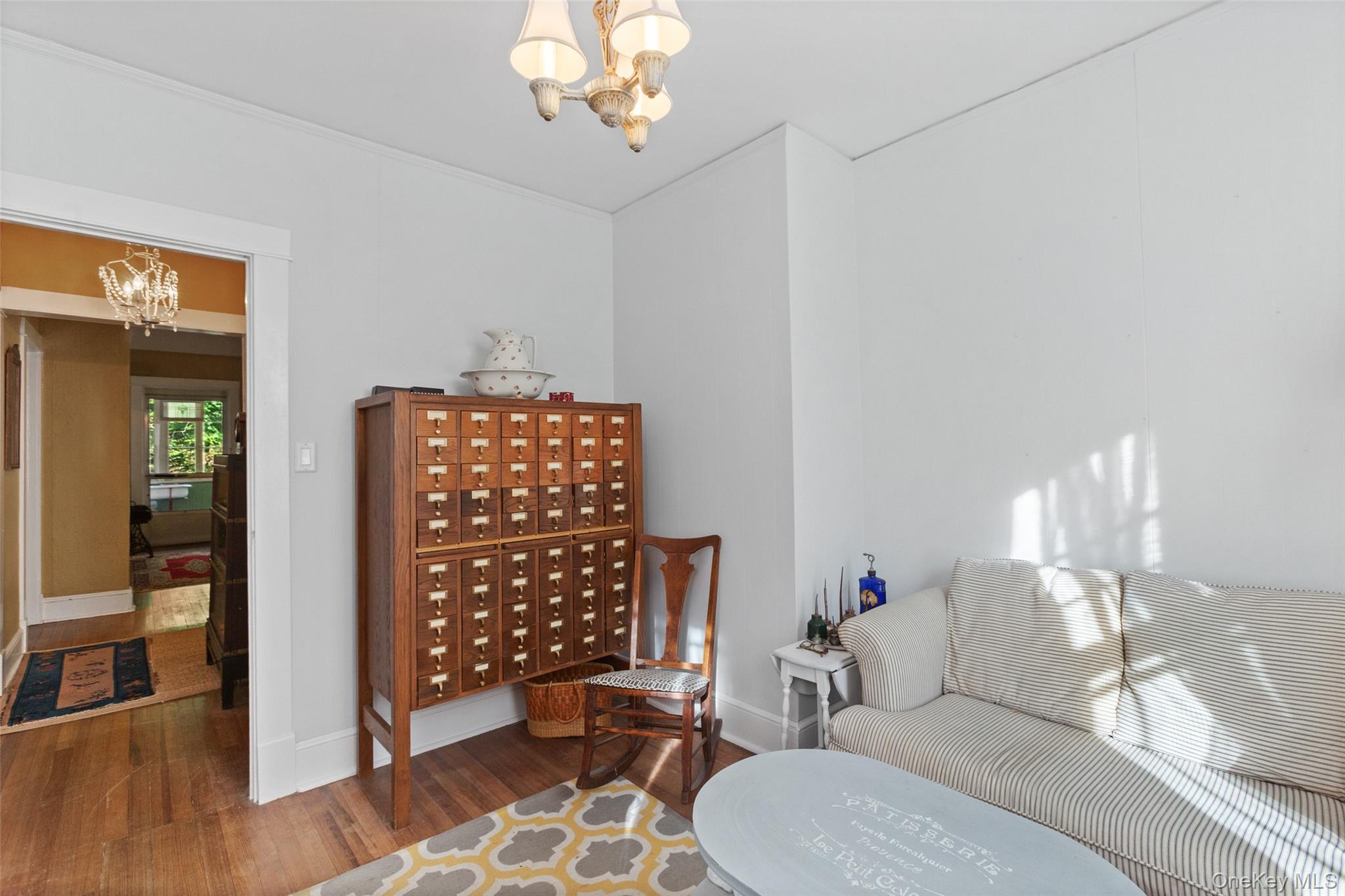 1753 Lawrence Road Mohegan Lake, NY 10547 - Photo 17 of 33 a living room with furniture a table and decor