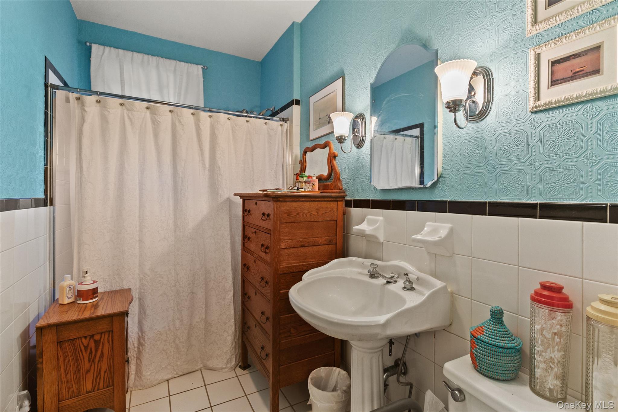 1753 Lawrence Road Mohegan Lake, NY 10547 - Photo 20 of 33 a bathroom with a sink a mirror and shower curtain