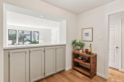 a very nice looking room with wooden floor and a window
