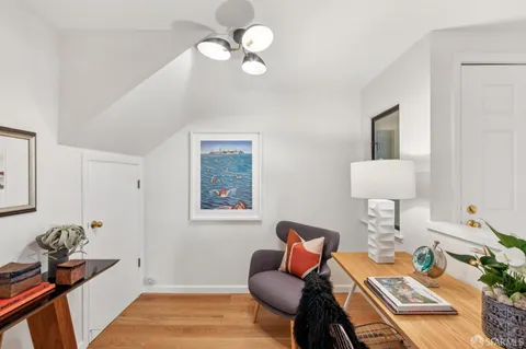 a bedroom with furniture and a window