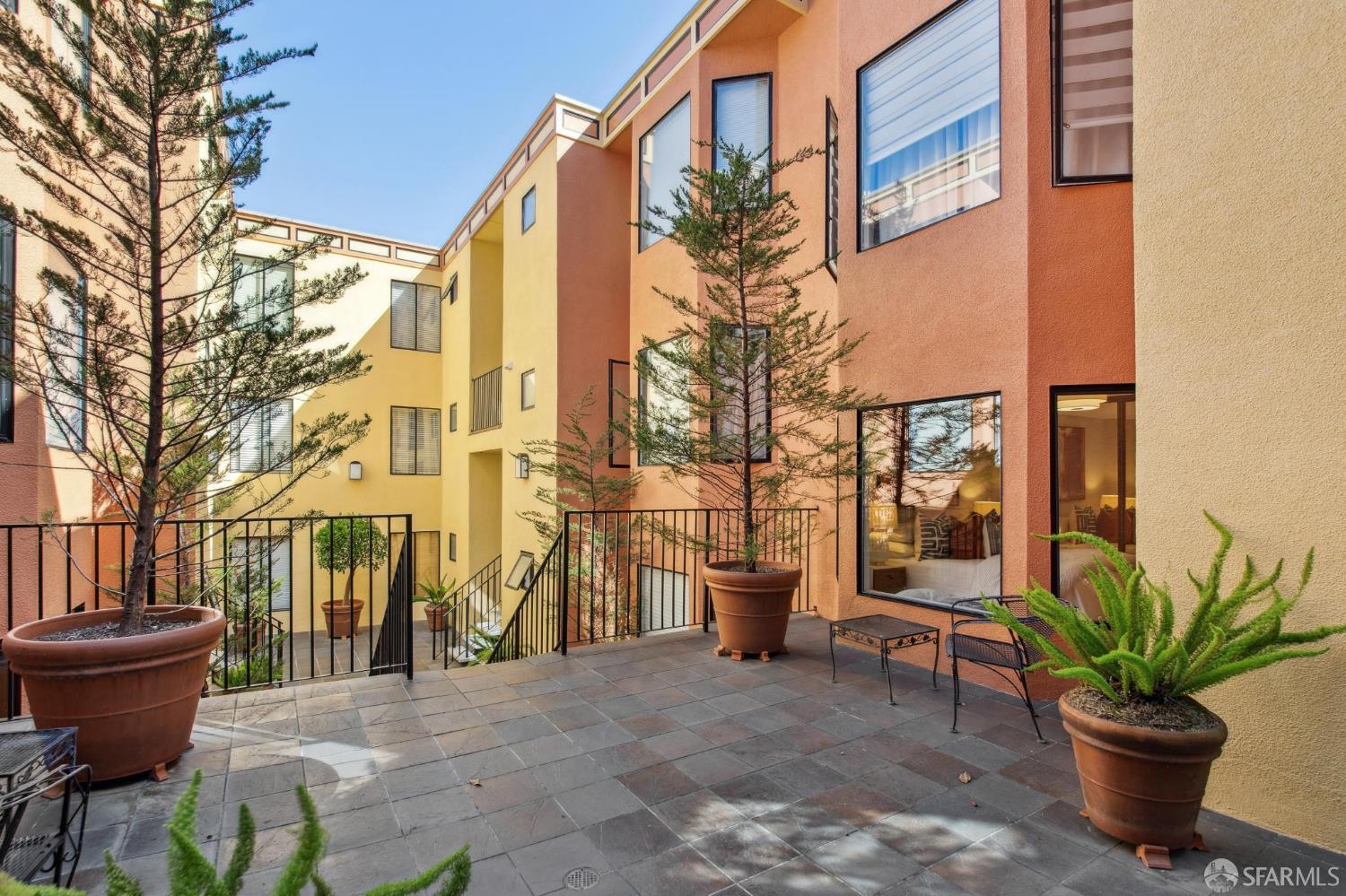 972 Haight Street San Francisco, CA 94117 - Photo 24 of 47 a backyard of a house with barbeque oven table and chairs