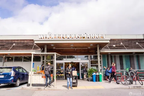 a view of a food market with retail shops