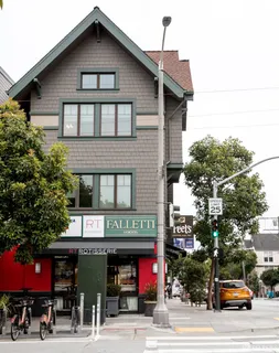 a view of a building with sitting area