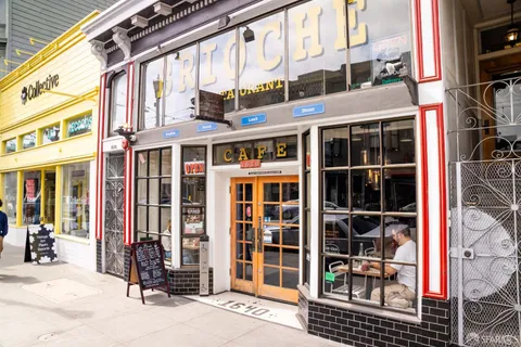 a view of entryway with a building and potted plant