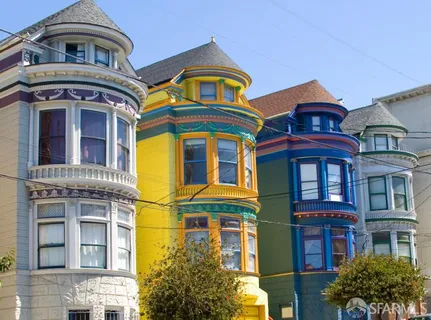 a front view of a house with a garden and plants