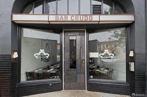 a view of a building with retail shop and windows