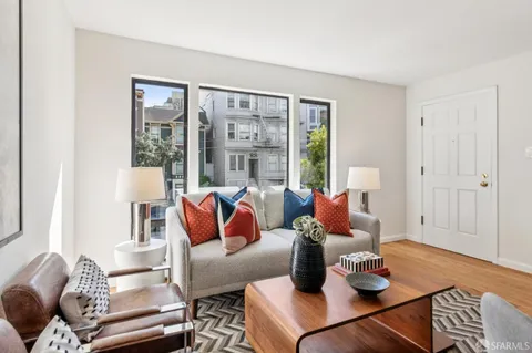 a living room with furniture and a window